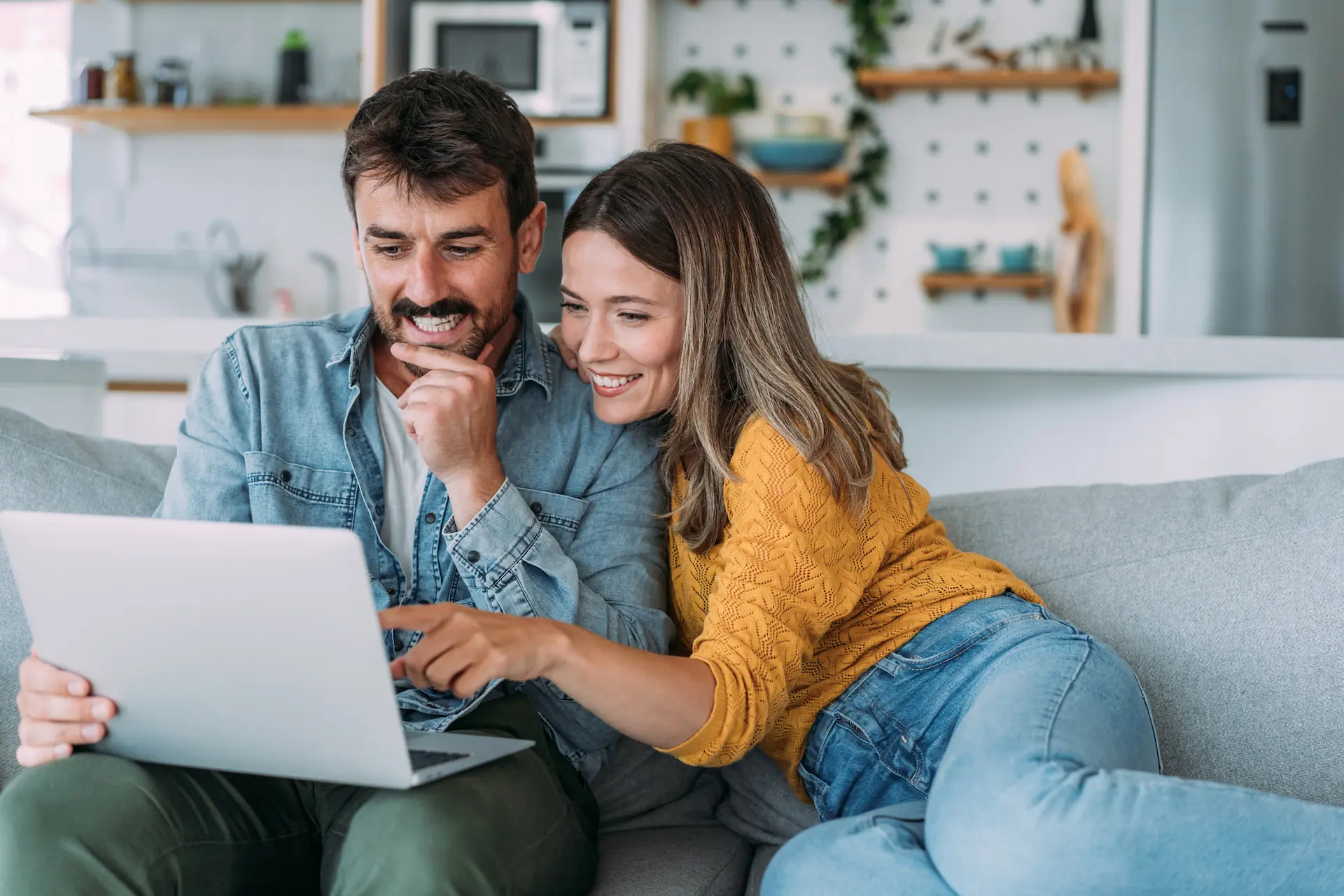 couple-looking-on-a-laptop Contact Us