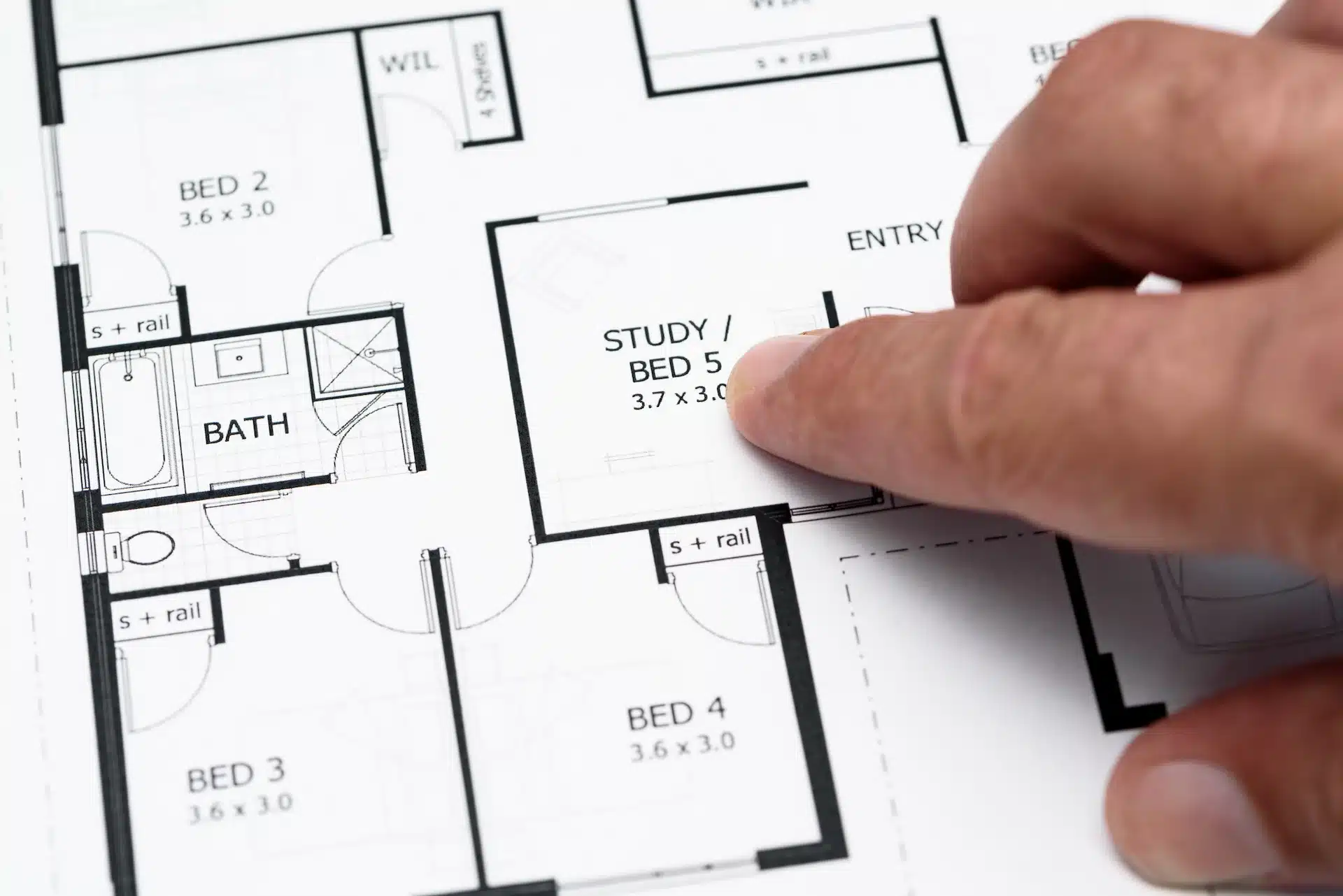 person-pointing-at-a-house-plan New Build Property Conveyancing and the Process